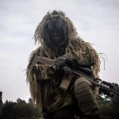 DTNVS-MG | Gen 3 White Phosphor W/ 2700 FOM -Tactical Equipment Soldier in disguise wearing a helmet with the Act in Black DTNVS MG Binocular attached 2ac359dc 18f3 43b2 8abd 23821099fd12