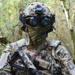 DTNVS-MG | Gen 3 White Phosphor W/ 2700 FOM -Tactical Equipment Soldier in the woods wearing a helmet with the Act in Black DTNVS MG Binocular attached 12d939dd d112 4c9c ac86 ad12925afea9