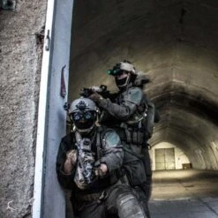 DTNVS-MG | Gen 3 White Phosphor W/ 2700 FOM -Tactical Equipment Soldiers on a mission wearing helmets with the Act in Black DTNVS MG Binocular attached 53d4bed4 dfcf 4fca aace 127fb0152020