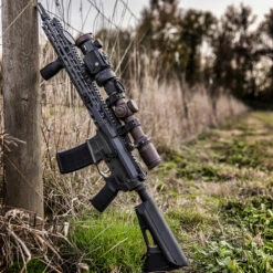 IRay Mate MAH50 | 50mm Clip-On Thermal W/ 2400 Yard Range 36 IRay Mate MAH50 | 50mm Clip-On Thermal W/ 2400 Yard Range -Tactical Equipment gallery image rifle equipped with iray mate mah50 leaning on fence post