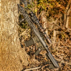IRay Mate MAH50 | 50mm Clip-On Thermal W/ 2400 Yard Range 25 IRay Mate MAH50 | 50mm Clip-On Thermal W/ 2400 Yard Range -Tactical Equipment gallery image rifle equipped with iray mate mah50 leaning on tree