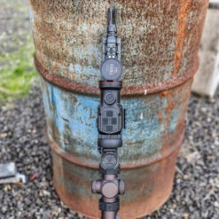 IRay Mate MAH50 | 50mm Clip-On Thermal W/ 2400 Yard Range 27 IRay Mate MAH50 | 50mm Clip-On Thermal W/ 2400 Yard Range -Tactical Equipment in description image top view of rifle equipped with iray mate mah50 leaning on rusty metal drum