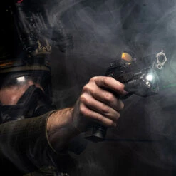 SureFire XVL2-IRC WeaponLight | Light And Laser Module System 13 SureFire XVL2-IRC WeaponLight | Light And Laser Module System -Tactical Equipment operative holding pistol mounted with the surefire xvl2 irc