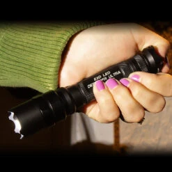 SureFire E2D Defender | 1,000 Lumens 13 SureFire E2D Defender | 1,000 Lumens -Tactical Equipment woman with pink nails holding a surefire e2d defender side left angle gallery